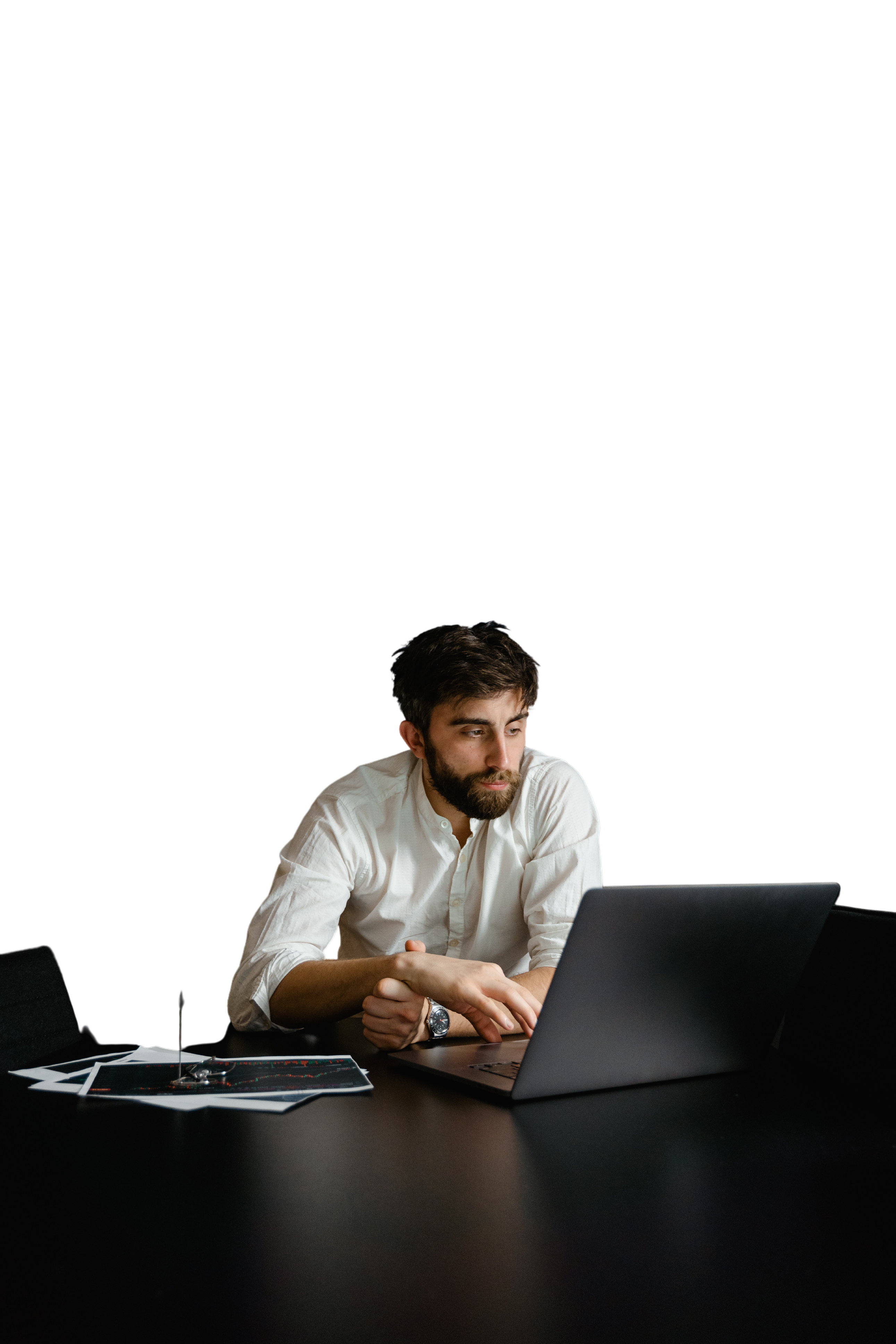 A Man in White Long Sleeves Using His Laptop